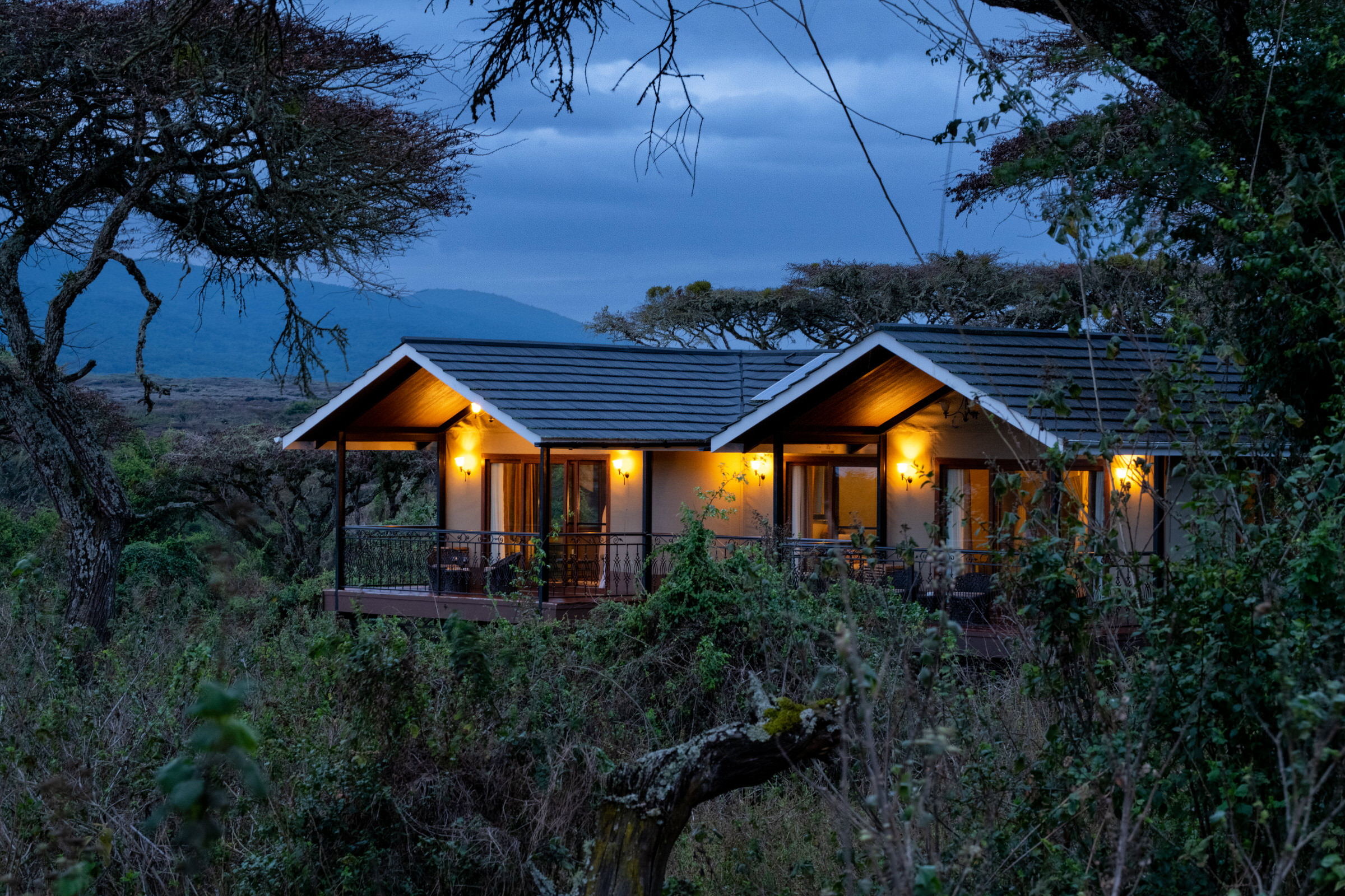 Lodge cottages lit up at dusk
