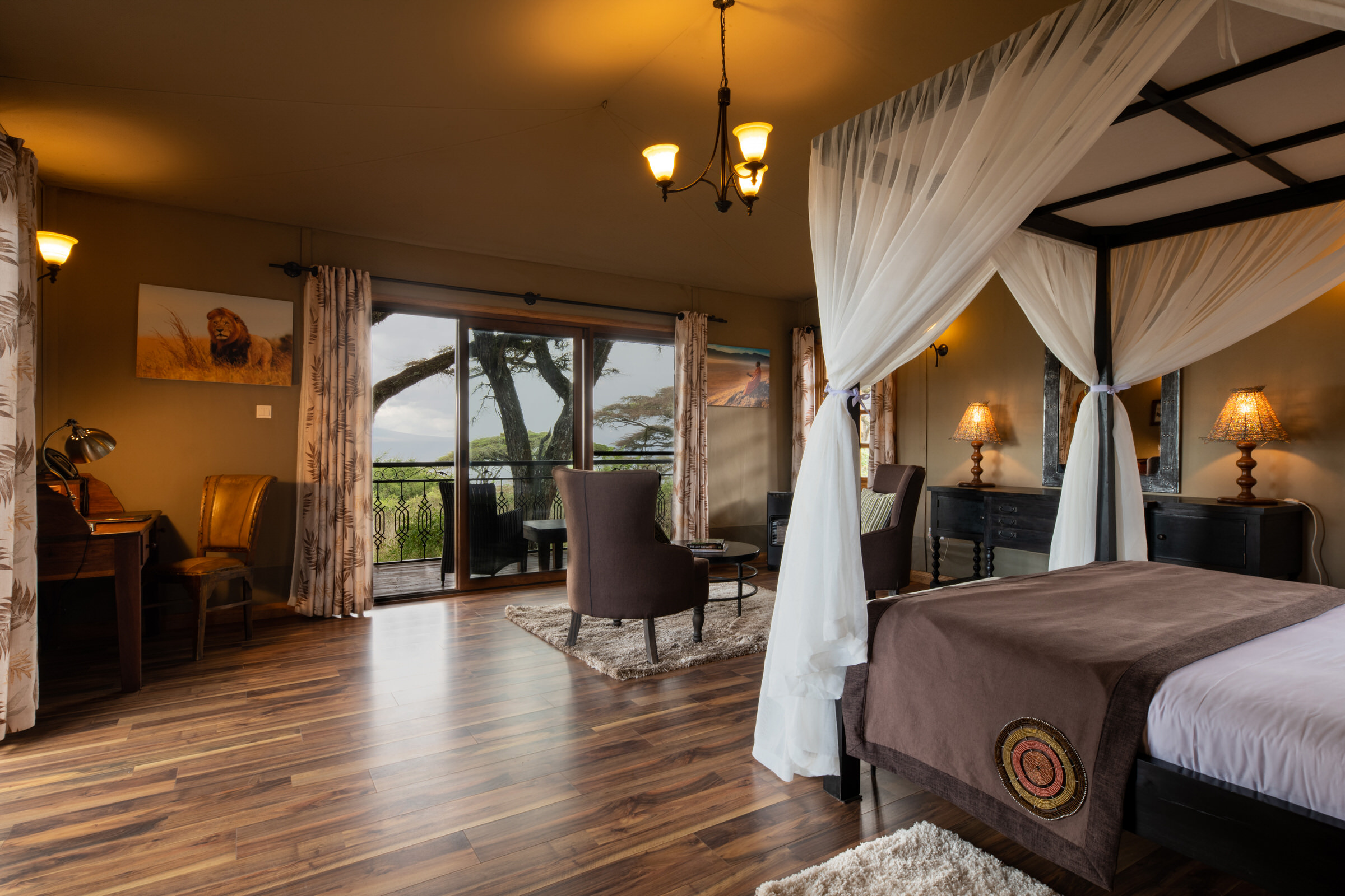 A hotel room with a four-poster bed